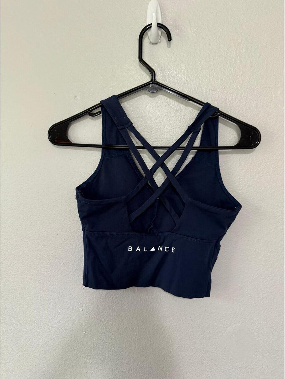 Vitality sports bra size small (has pads) 
Navy blue